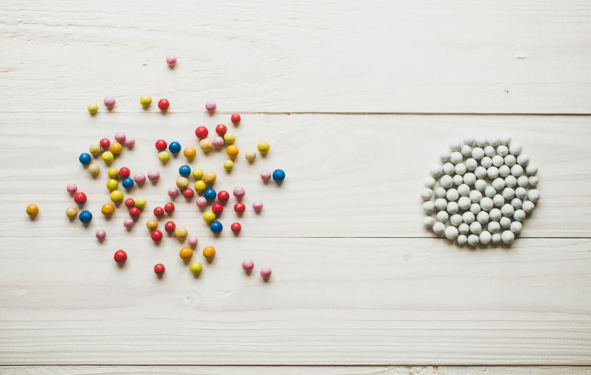 Chaotic colorful balls and organized white balls